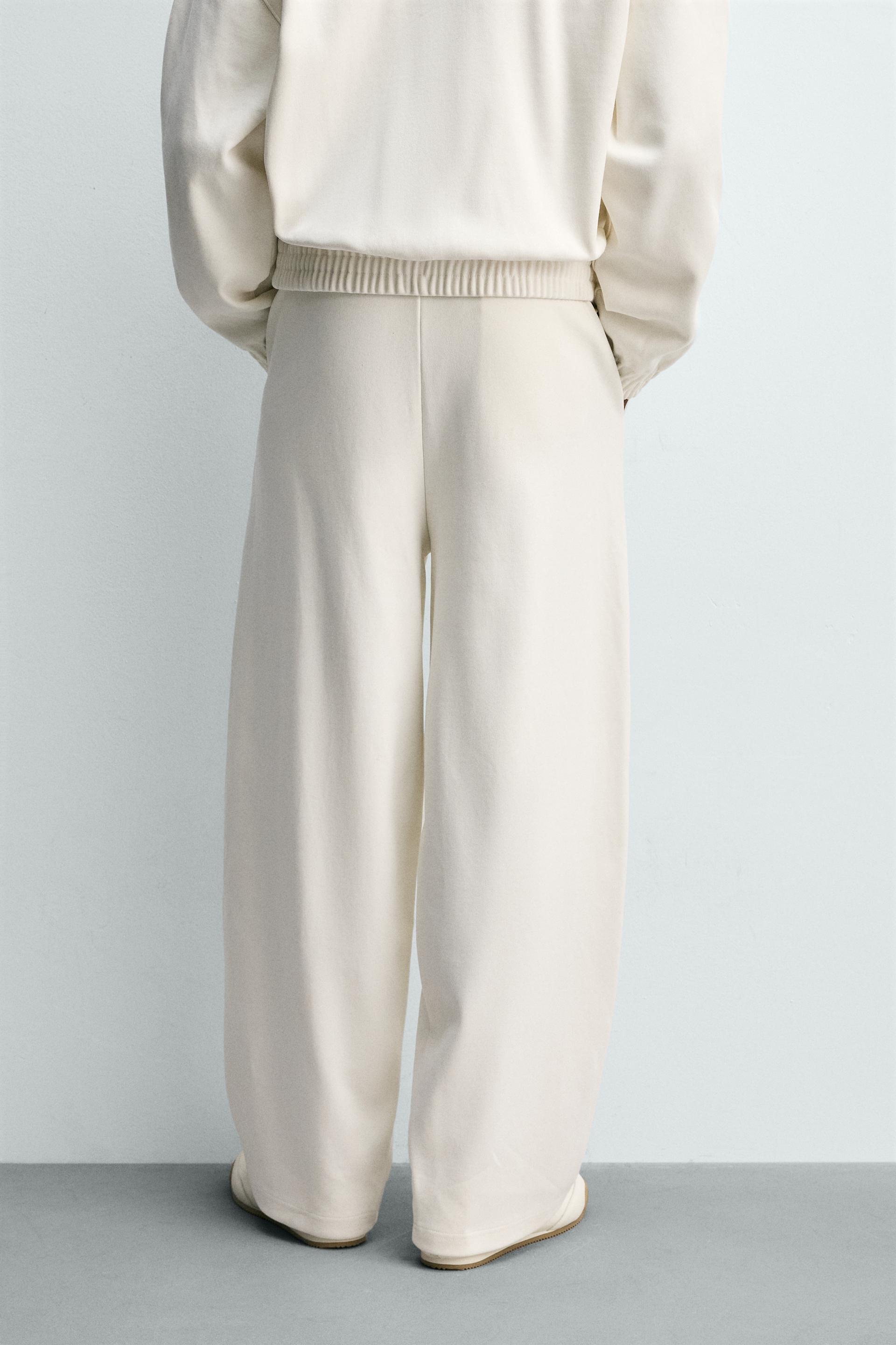 PLEATED WIDE FIT JOGGER PANTS