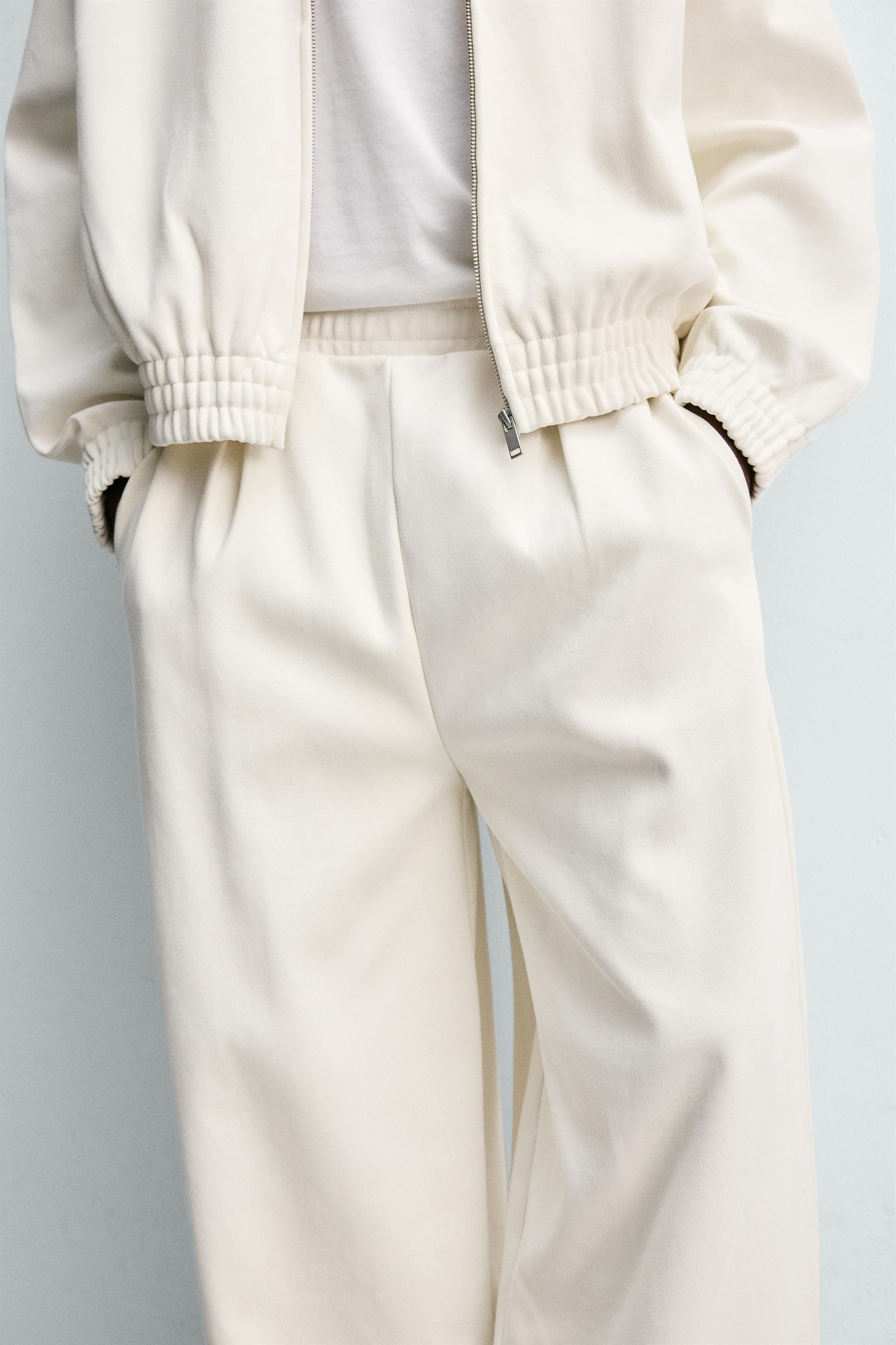 PLEATED WIDE FIT JOGGER PANTS
